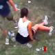 An attractive brunette girl shits while sitting on the lawn at a concert while others watch in disbelief. The crazy things women do! About 1.5 minutes.
